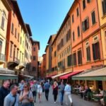 Bologna Egyetemi negyedének hangulatos utcája kávéházakkal.