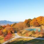 Fukushima Azuma Sportpark őszi táj hegyekkel és modern sportpályával.