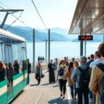 Genf tömegközlekedés a tavon, turisták a villamos megállóban