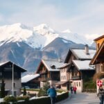 Zermatti városkép a svájci Alpokban, hóval borított hegyek háttérrel.