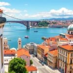 Lisszabon városkép a híddal és a vízparttal