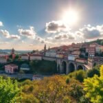 Braga város panorámája a napfényben, gyönyörű épületekkel és zöld növényzettel.