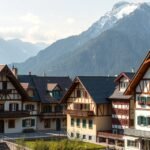 Oberammergau festett házai és az Alpok háttérben